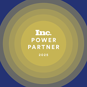 A circular badge with concentric rings in yellow and gray displays the text Inc. Power Partner 2025 in white, centered on a dark blue background.